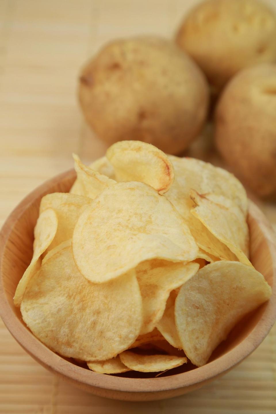 <p>Sorry, potato chips: It's been scientifically proven that these foods are loaded with simple <a rel="nofollow noopener" href="http://www.health.com/health/gallery/0,,20818045,00.html#you-live-on-junk-food-0" target="_blank" data-ylk="slk:carbs and sugar;elm:context_link;itc:0;sec:content-canvas" class="link ">carbs and sugar</a>, which result in frequent blood sugar spikes, followed by sharp drops that result in tiredness. Maybe that's why these foods are almost always paired with binge-watching sessions.</p>