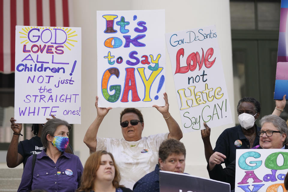 Demonstrators gather to speak on the steps of the Florida Historic Capitol Museum in front of the Florida State Capitol, Monday, March 7, 2022, in Tallahassee, Fla. Florida House Republicans advanced a bill, dubbed by opponents as the 