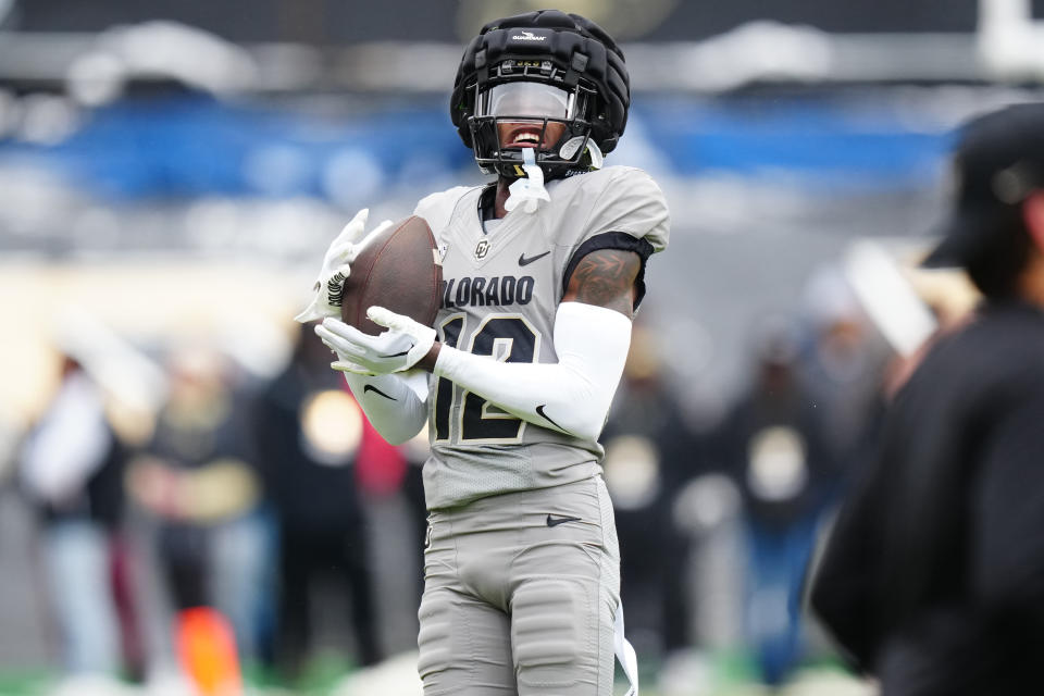 Apr 22, 2023; Boulder, CO, USA; Colorado Buffaloes cornerback <a class="link " href="https://sports.yahoo.com/ncaaf/players/338035" data-i13n="sec:content-canvas;subsec:anchor_text;elm:context_link" data-ylk="slk:Travis Hunter;sec:content-canvas;subsec:anchor_text;elm:context_link;itc:0">Travis Hunter</a> (12) before the start of the spring game at Folsom Field. Mandatory Credit: Ron Chenoy-USA TODAY Sports