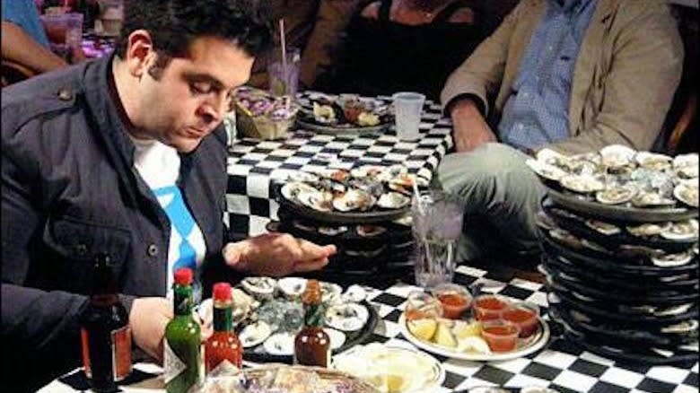 Adam Richman eating oysters