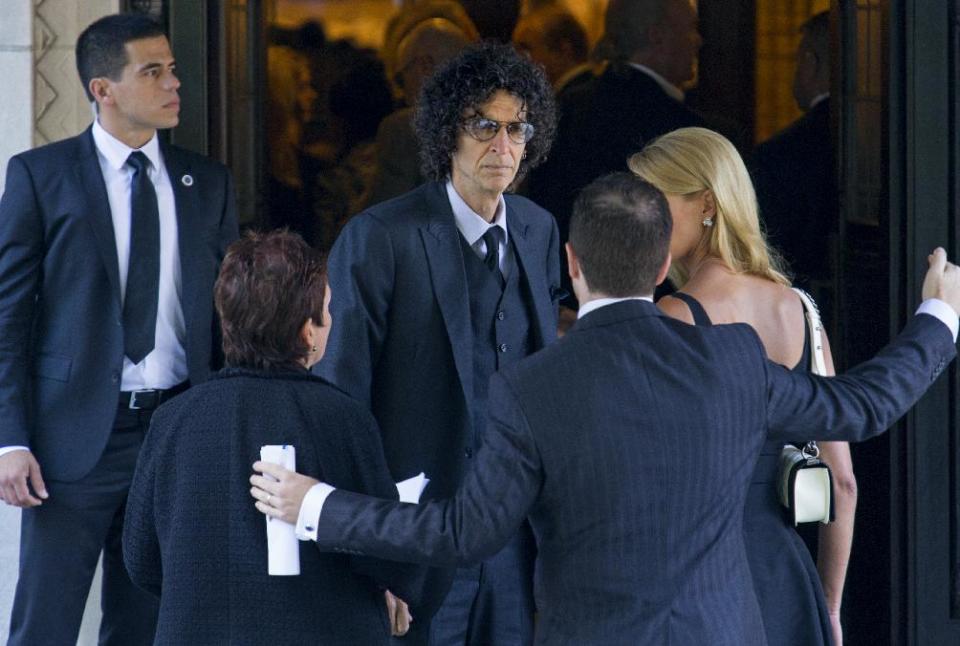 Howard Stern, center, arrives at a funeral service for comedian Joan Rivers at Temple Emanu-El in New York, Sunday, Sept. 7, 2014. Rivers died Thursday, Sept. 4, 2014. She was 81. (AP Photo/Craig Ruttle)