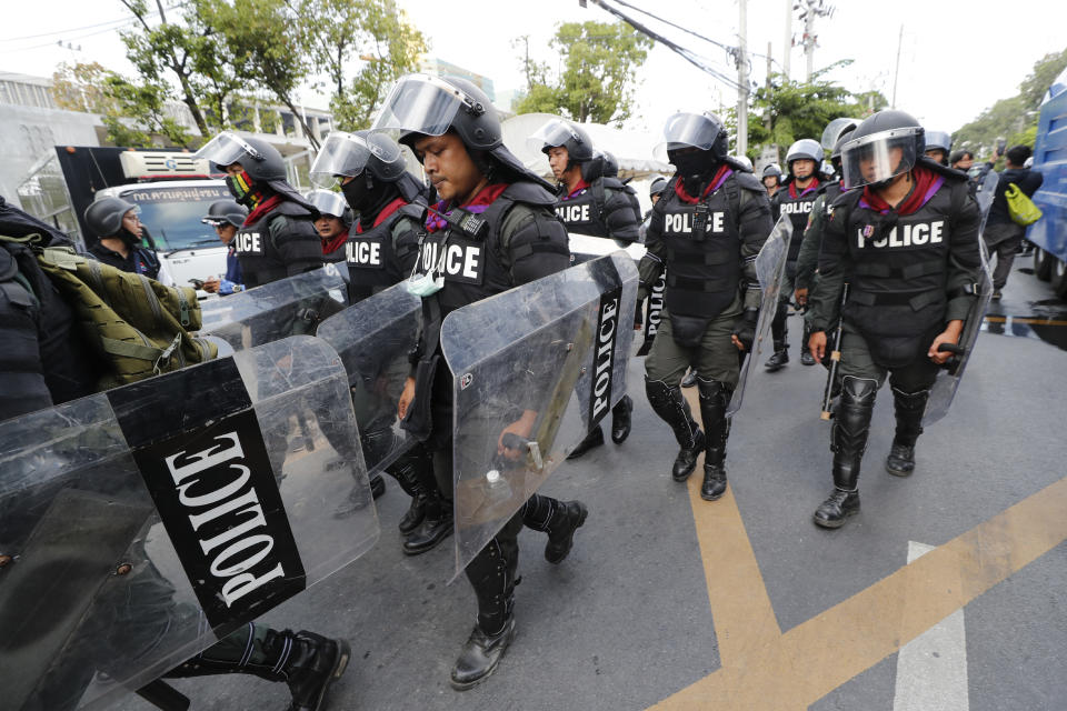 Police in riot gear deployed to disperse pro-democracy demonstrators near the Parliament in Bangkok, Tuesday, Nov. 17, 2020. Thailand's political battleground shifted to the country's Parliament Tuesday, where lawmakers are considering proposals to amend the country's constitution, one of the core demands of the student-led pro-democracy movement. (AP Photo/Sakchai Lalit)