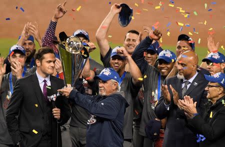 Mar 22, 2017; Los Angeles, CA, USA; USA manager Jim Leyland holds up the championship trophy after defeating Puerto Rico to win the 2017 World Baseball Classic at Dodger Stadium. Robert Hanashiro-USA TODAY Sports