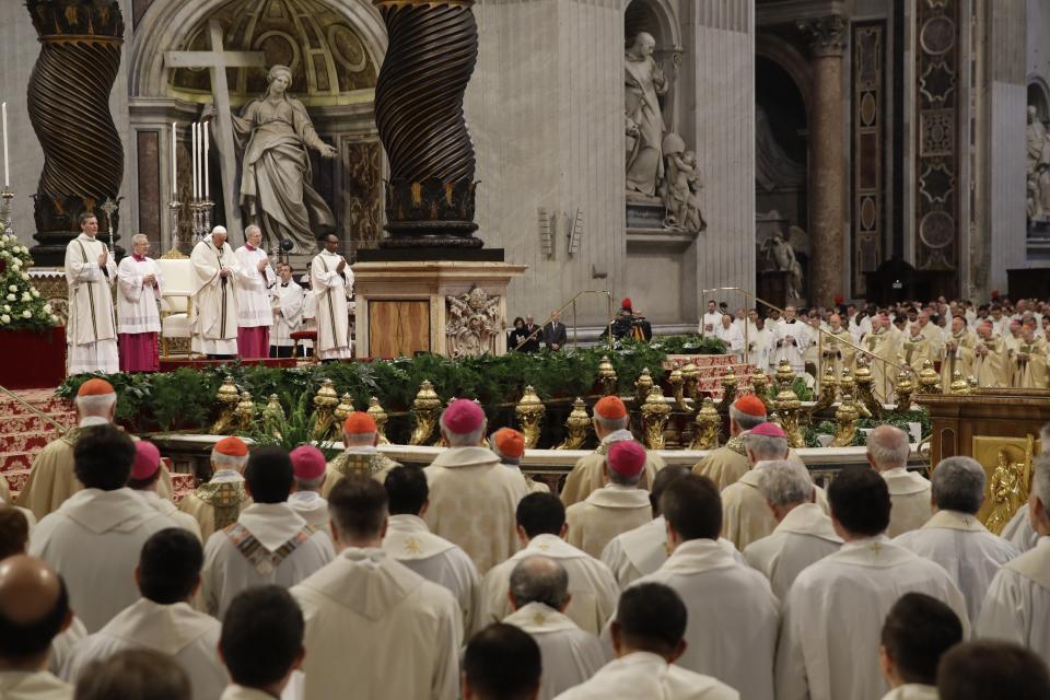 Pope Francis, third from left, top, celebrates a Chrism Mass inside St. Peter's Basilica, at the Vatican, Thursday, April 18, 2019. During the Mass the Pontiff blesses a token amount of oil that will be used to administer the sacraments for the year. (AP Photo/Alessandra Tarantino)