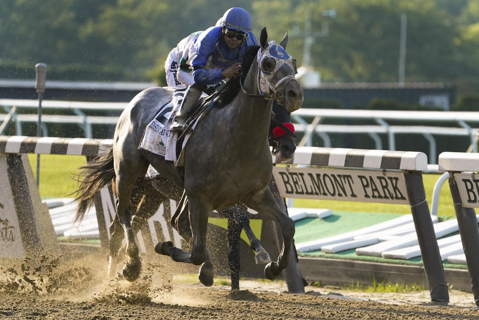 FILE - Essential Quality (2), Luis Saez up, crosses the finish line to win the 153rd running of the Belmont Stakes horse race, Saturday, June 5, 2021, at Belmont Park in Elmont, N.Y. Medina Spirit, controversial winner of the Kentucky Derby, and Belmont Stakes winner Essential Quality head a field of 10 horses for the Breeders’ Cup Classic. (AP Photo/John Minchillo, File)