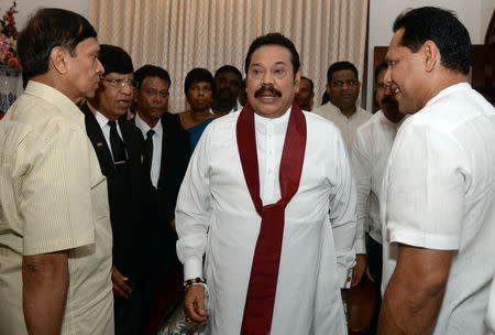 Sri Lanka's former leader Mahinda Rajapaksa shares a moment with his political party supporters after he resigned from the prime minister post in Colombo, Sri Lanka December 15, 2018. REUTERS/Stringer