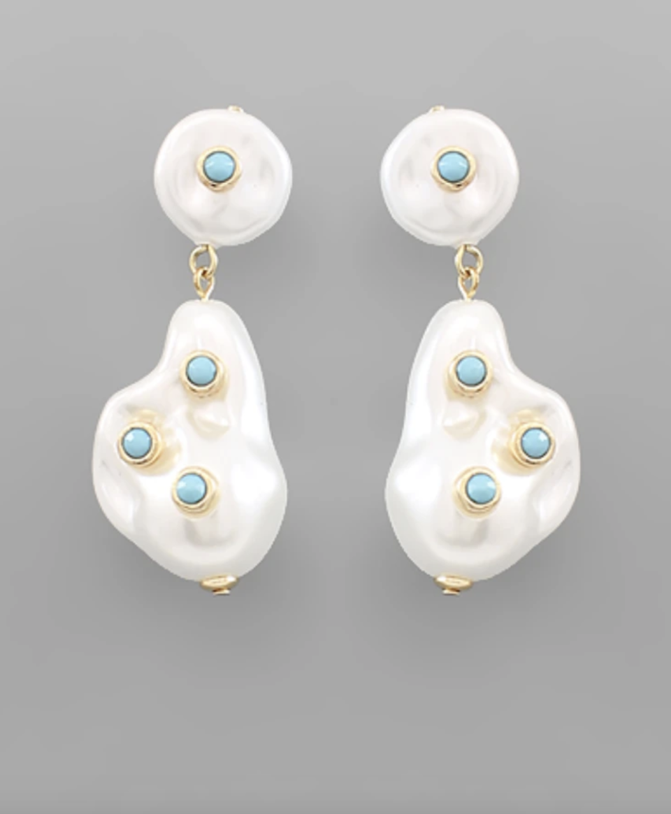 <p><strong>Humans Before Handles</strong></p><p><strong>$45.00</strong></p><p><a href="https://www.humansbeforehandles.com/collections/statement-earrings/products/daphne-pearls?variant=40835363274921" rel="nofollow noopener" target="_blank" data-ylk="slk:Shop Now;elm:context_link;itc:0;sec:content-canvas" class="link ">Shop Now</a></p><p>These even feature pops of a pretty aqua color. </p>