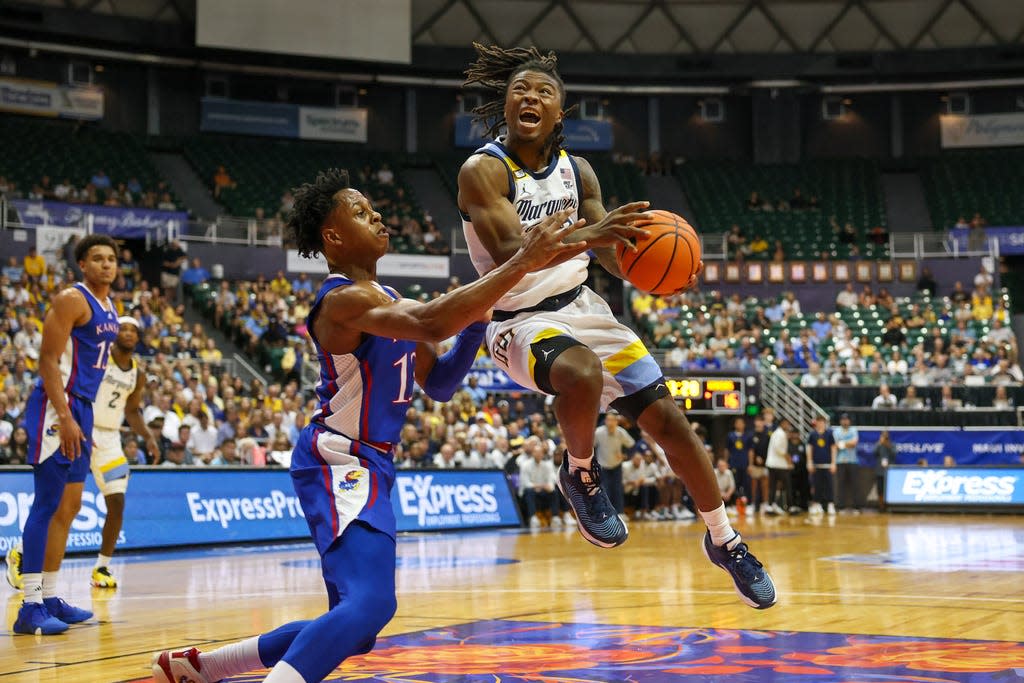Sean Jones scores nine points off the bench to help Marquette beat Kansas in the semifinals of the Maui Invitational.