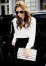 <b>Victoria Beckham</b><br><br> VB kept it simple with a monochrome look. A classic white shirt and black trousers teamed with a studded clutch. <br><br>© REX