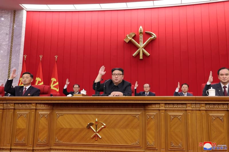 An undated picture released by the North Korean State news Agency (KCNA) on 25 January 2024 shows North Korean leader Kim Jong-un (C) attending the 19th enlarged meeting of the political bureau of the 8th Central Committee of the Workers' Party. -/KCNA via YNA/dpa