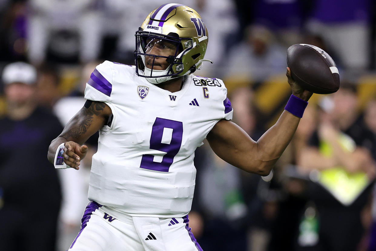 HOUSTON, TEXAS - JANUARY 08:  Michael Penix Jr. #9 of the Washington Huskies throws the ball in the first quarter against the Michigan Wolverines during the 2024 CFP National Championship game at NRG Stadium on January 08, 2024 in Houston, Texas. (Photo by Maddie Meyer/Getty Images)