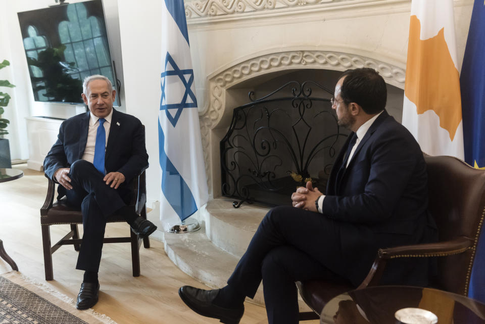 Cypriot president Nikos Christodoulides, right, and Israeli Prime Minister Benjamin Netanyahu speak, during their meeting at the presidential palace in the capital Nicosia, Cyprus, on Sunday, Sept. 3, 2023. An official statement said Christodoulides and Netanyahu will touch on expanding energy cooperation and bilateral ties, as well as Israel's relations with the European Union. The leaders' meeting comes a day ahead of a trilateral meeting that will include Greek Prime Minister Kyriakos Mitsotakis. (Iakovos Hatzistavrou, Pool via AP)