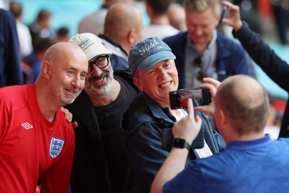 Frank Skinner and David Baddiel take a selfie with fans in the crowd during the UEFA Euro 2020 championship (Getty Images)