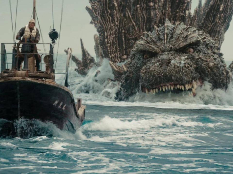 Godzilla in the ocean chasing a boat in "Godzilla Minus One."