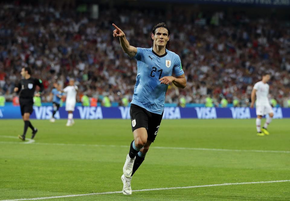 <p>Cavani celebrates his and Uruguay’s second goal against Portugal </p>