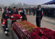 FILE- Police officers attend the funeral prayer of a colleague who was killed in an overnight attack by Pakistani Taliban who targeted police in multiple attacks in Islamabad and elsewhere in the country's northwest, in Islamabad, Pakistan, Jan. 18, 2022. Faced with rising violence, Pakistan is taking a tougher line to pressure Afghanistan’s Taliban rulers to crack down on militants hiding on their soil, but so far the Taliban remain reluctant to take action -- trying instead to broker a peace. (AP Photo, File)