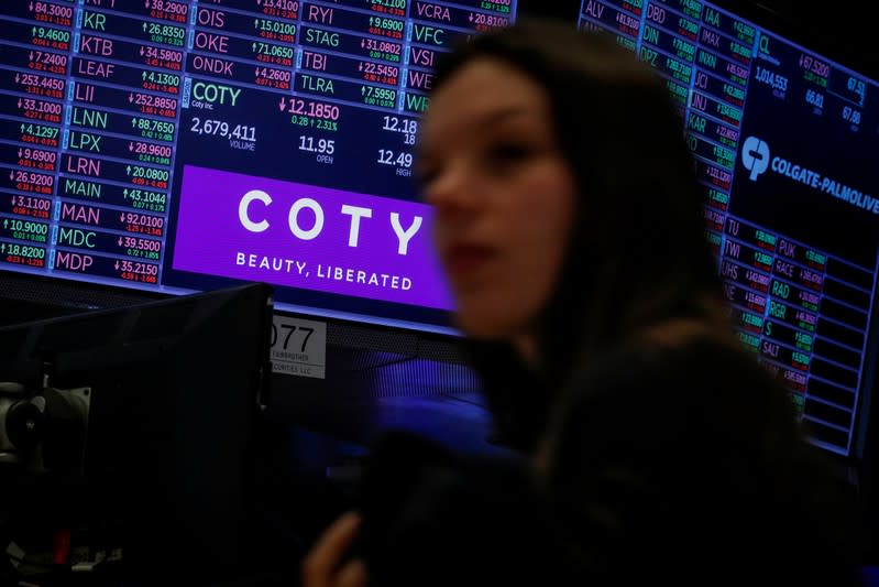 FILE PHOTO: A screen displays the logo and trading information for Coty Inc at the NYSE in New York