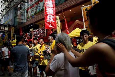 Pro-democracy protesters stage a march to demand universal suffrage, on the day marking the 19th anniversary of Hong Kong's handover to Chinese sovereignty from British rule, in Hong Kong, China July 1, 2016. REUTERS/Tyrone Siu