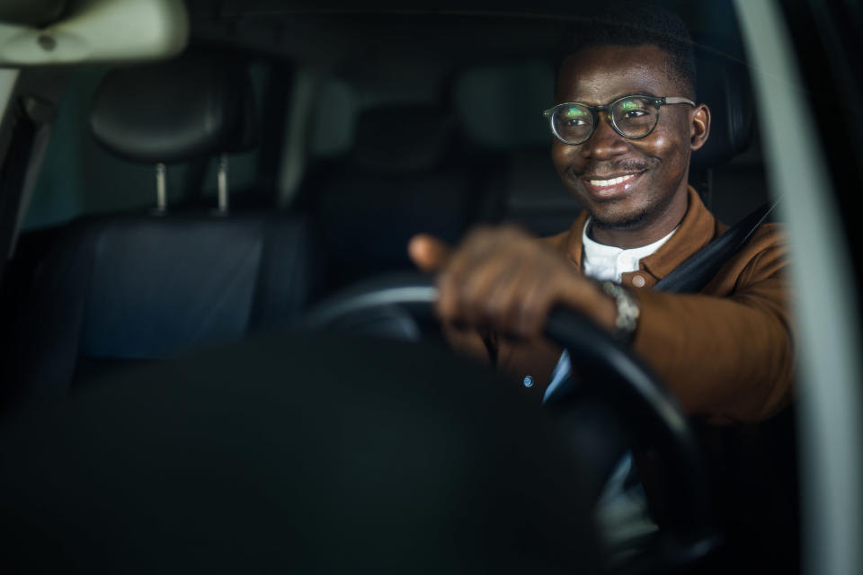 man driving in car