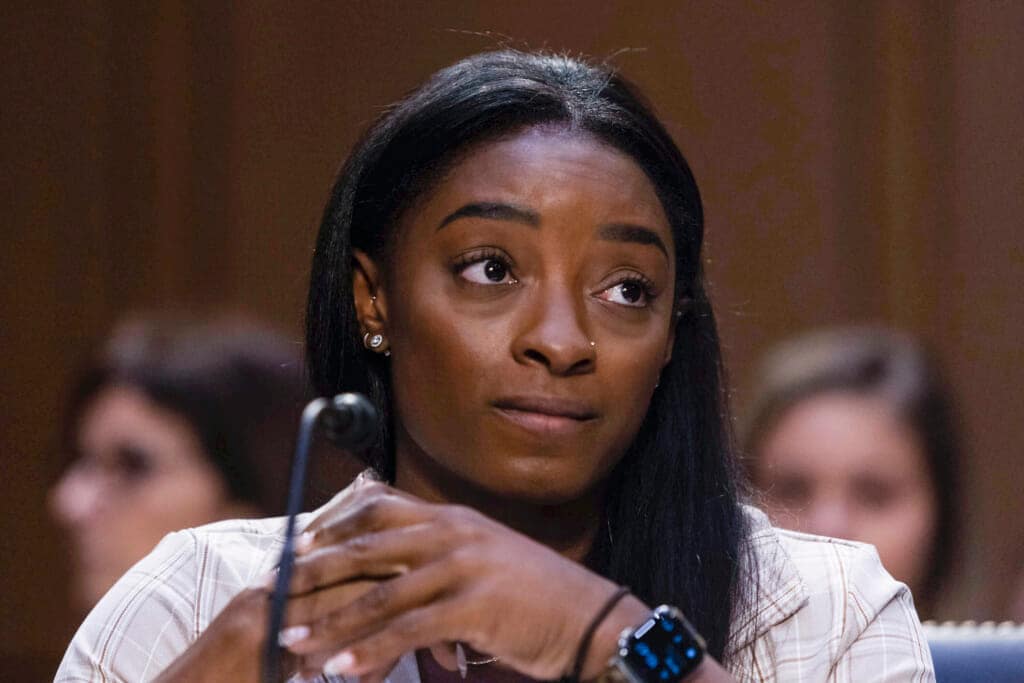 FILE – United States Olympic gymnast Simone Biles testifies during a Senate Judiciary hearing about the Inspector General’s report on the FBI’s handling of the Larry Nassar investigation on Capitol Hill, Wednesday, Sept. 15, 2021, in Washington. Olympic gold medalist Simone Biles and dozens of other women who say they were sexually assaulted by Larry Nassar are seeking more than $1 billion from the FBI for failing to stop the now convicted sports doctor when the agency first received allegations against him, lawyers said Wednesday, June 8, 2022. (Graeme Jennings/Pool via AP, File)