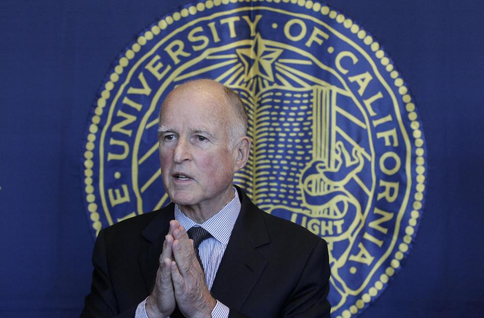 Gov. Jerry Brown speaks to reporters after attending a University of California Board of Regents meeting in San Francisco, Wednesday, Nov. 14, 2012. (AP Photo/Jeff Chiu)