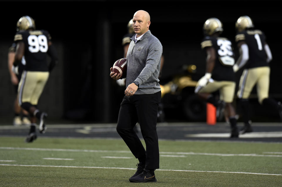 Vanderbilt head coach Clark Lea watches players warm up before an NCAA college football game against Stanford, Saturday, Sept. 18, 2021, in Nashville, Tenn. (AP Photo/Mark Zaleski)