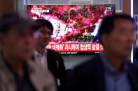 People watch a TV broadcasting a news report on the dismantling of the Punggye-ri nuclear testing site, in Seoul, South Korea, May 24, 2018. REUTERS/Kim Hong-Ji