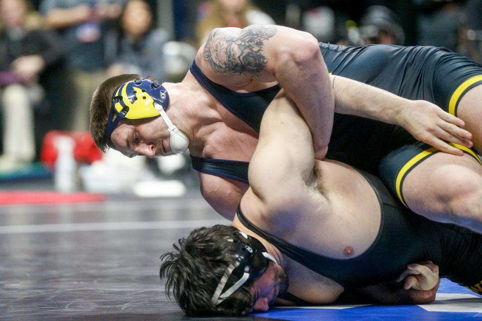 Michigan's Mason Parris attempts to turn Iowa's Tony Cassioppi during the semifinal round of the NCAA Wrestling Championships 2023 at the BOK Center in Tulsa, Okla. on Friday, March 17, 2023.