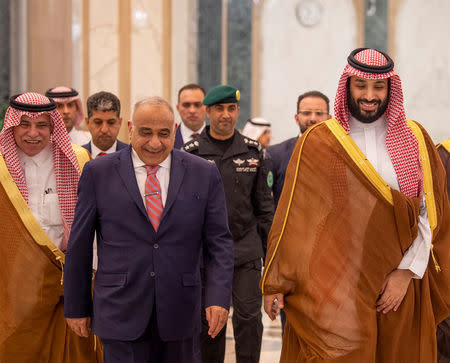 Saudi Arabia's Crown Prince Mohammed bin Salman walks with Iraq's Prime Minister Adel Abdul Mahdi in Riyadh, Saudi Arabia April 17, 2019. Picture taken April 17, 2019. Bandar Algaloud/Courtesy of Saudi Royal Court/Handout via REUTERS