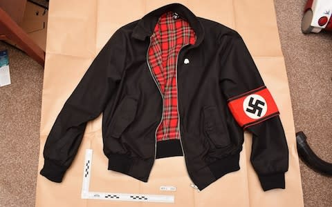 Photo shown to jurors of a jacket bearing a Swastika armband found during police searches of the home of Adam Thomas and Claudia Patatas. - Credit: West Midlands Police/ PA