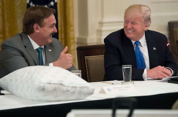 PHOTO: President Donald Trump speaks alongside Mike Lindell (L), founder of My Pillow, during a Made in America event with US manufacturers in the East Room of the White House, July 19, 2017. (Saul Loeb/AFP via Getty Images)