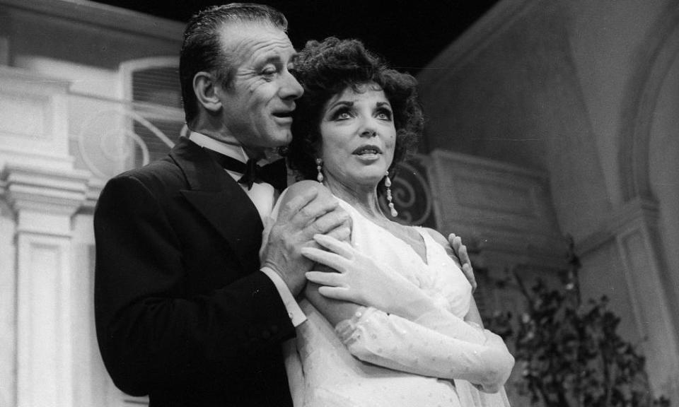 Keith Baxter, as Elyot, and Joan Collins, as Amanda, in Private Lives by Noël Coward at the Aldwych theatre, London, 1990.