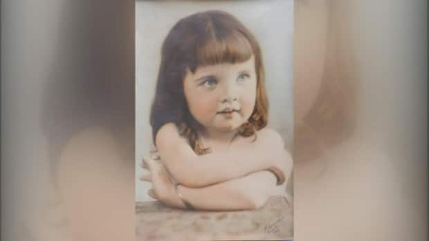 This photograph of a little girl, dated 1924 and signed by a well-known American photographer, has sparked a mystery after it was discovered in a Grande Cache, Alta., thrift shop. (Submitted by Elesa Willies - image credit)