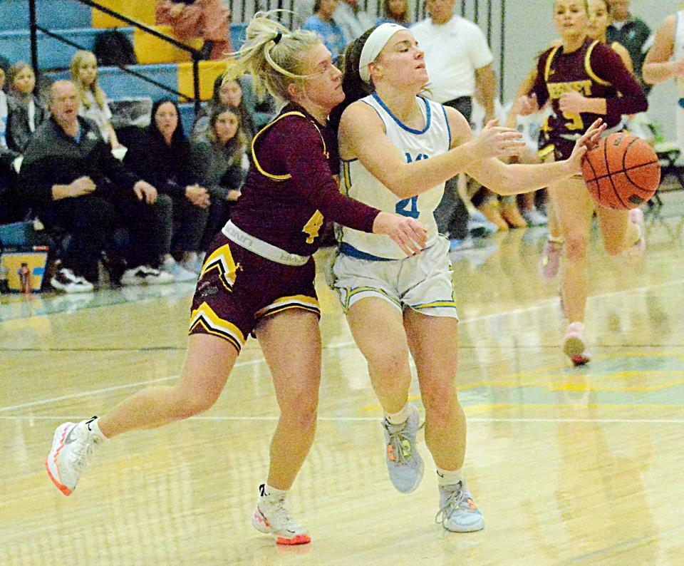 Hamlin's Brooklyn Brandriet is fouled by De Smet's Alyssa Asleson during a Lake Central Conference high school basketball doubleheader on Tuesday, Jan. 17, 2023 at the Hamlin Education Center.