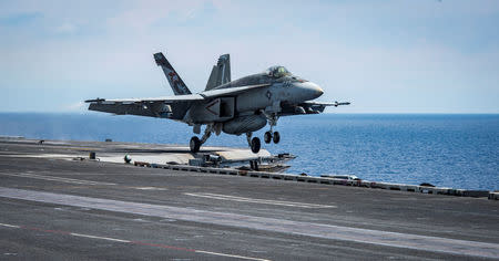 An F/A-18E Super Hornet from the "Kestrels" of Strike Fighter Squadron (VFA) 137 takes off from the aircraft carrier USS Carl Vinson (CVN 70) transiting the South China Sea April 10, 2017. Picture taken April 10, 2017. U.S. Navy photo by Mass Communication Specialist 2nd Class Sean M. Castellano/Handout via REUTERS ATTENTION EDITORS - THIS IMAGE WAS PROVIDED BY A THIRD PARTY. EDITORIAL USE ONLY.