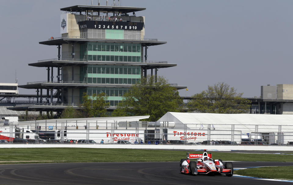 Juan Pablo Montoya, of Colombia, drives out of turn 7 during practice for the inaugural Grand Prix of Indianapolis IndyCar auto race at the Indianapolis Motor Speedway in Indianapolis, Thursday, May 8, 2014. (AP Photo/Michael Conroy)