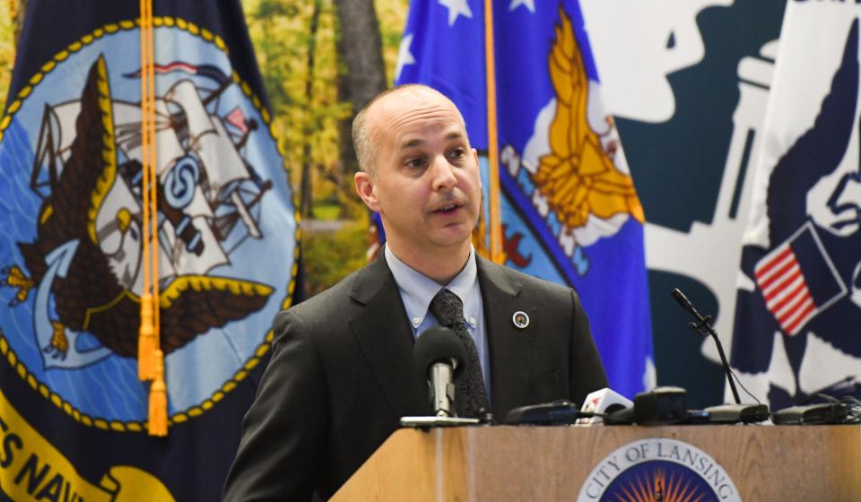 Lansing Mayor Andy Schor, pictured speaking on Monday, Dec. 13, 2021, during a presser at Lansing City Hall, has tested positive for COVID-19.