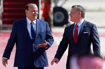 Jordan's King Abdullah II welcomes YemeniÕs President Abd-Rabbu Mansour Hadi (L) during a reception ceremony at the Queen Alia International Airport in Amman, Jordan March 28, 2017. REUTERS/Muhammad Hamed