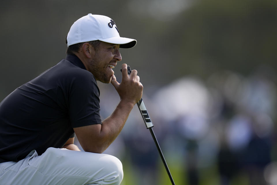 Xander Schauffele waits to putt on the first hole of the Sorth Course at Torrey Pines during the third round of the Farmers Insurance Open golf tournament, Friday, Jan. 26, 2024, in San Diego. (AP Photo/Gregory Bull)