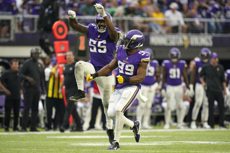 Minnesota Vikings linebacker Danielle Hunter (99) celebrates with teammate linebacker Za'Darius Smith (55) after sacking Green Bay Packers quarterback Aaron Rodgers during the second half of an NFL football game, Sunday, Sept. 11, 2022, in Minneapolis. (AP Photo/Abbie Parr)