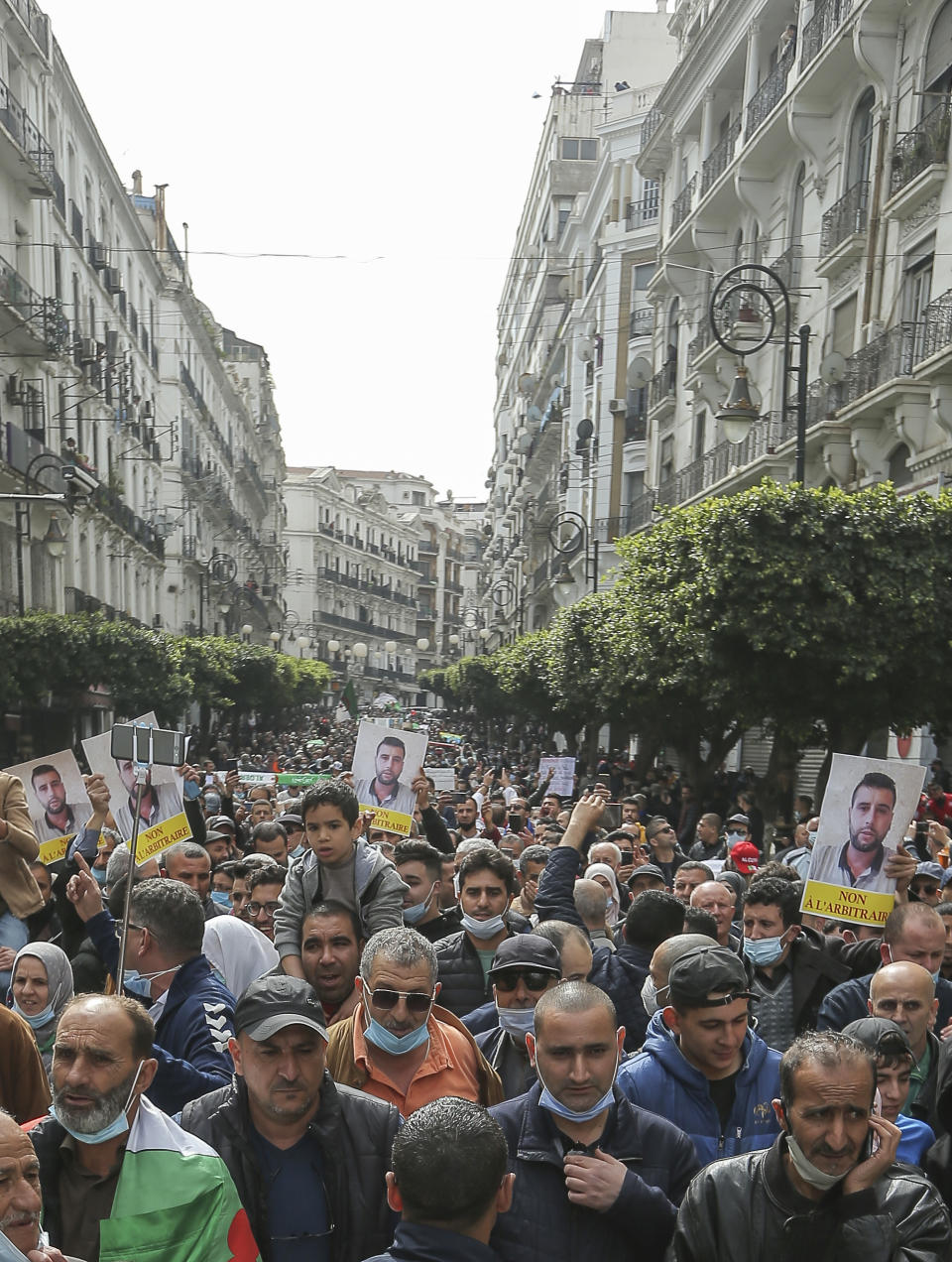 People demonstrate for a second time this week in Algiers, Algeria, Feb. 26, 2021. Algerians turned out on Friday in the streets of the capital and scattered cities around their North African country to demonstrate in the pro-democracy movement, four days after tens of thousands of marchers marked Hirak's second anniversary. (AP Photo/Anis Belghoul)