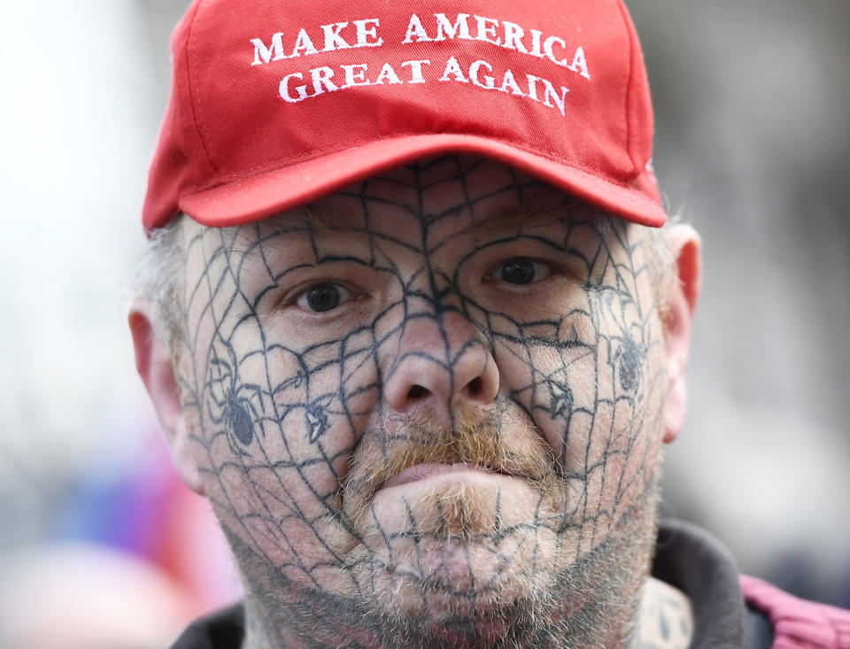 A supporter of Israel’s Prime Minister Benjamin Netanyahu wears a Donald Trump campaign hat