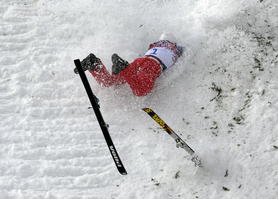 China's Liu Zhongqing crashes during freestyle skiing aerials training at the Rosa Khutor Extreme Park at the 2014 Winter Olympics, Monday, Feb. 10, 2014, in Krasnaya Polyana, Russia. (AP Photo/Andy Wong)