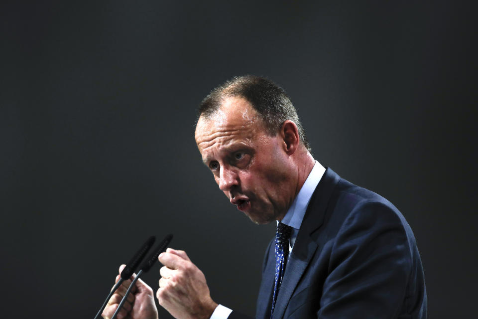 FILE - In this Friday, Dec. 7, 2018. File photo, Friedrich Merz party member and candidate for the Christian Democratic Union, CDU, party chairmanship delivers his speech during a party convention in Hamburg, Germany. German Chancellor Angela Merkel's center-right party, the Christian Democratic Union, CDU, is choosing a new leader on the weekend Saturday Jan. 16 and Sunday Jan. 17, 2021, a decision that will help determine who succeeds Merkel at the helm of the European Union's biggest economy after a 16-year reign. (AP Photo/Markus Schreiber, file)