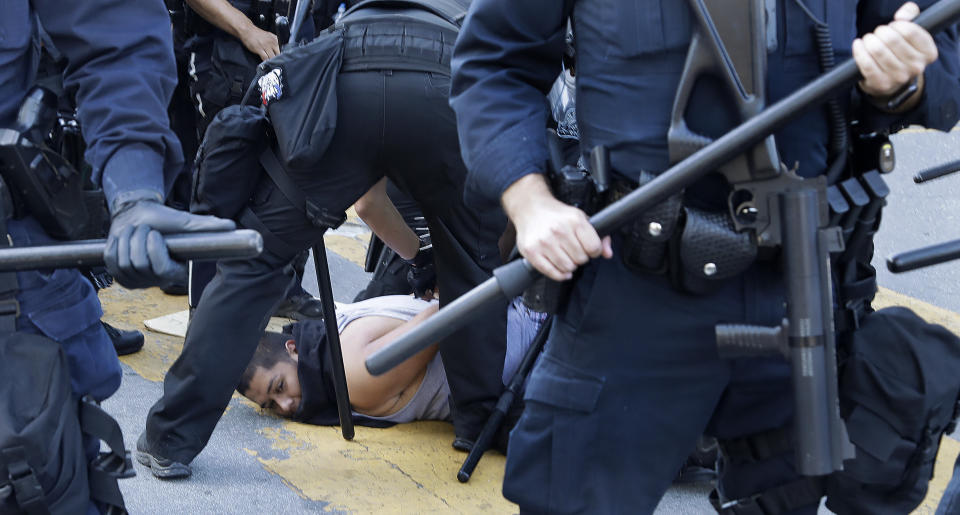 A protester is arrested on Friday in San Jose, California. (Photo: ASSOCIATED PRESS)