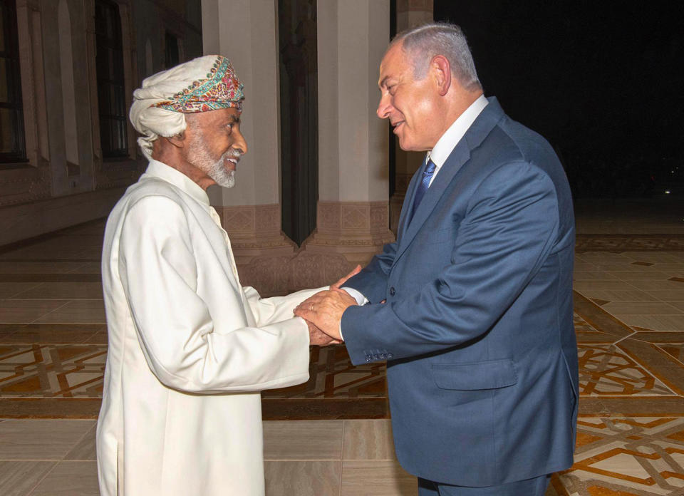 FILE- In this Friday, Oct. 26, 2018 file photo, released by Oman News Agency, Oman's Sultan Qaboos, left, receives Israeli Prime Minister Benjamin Netanyahu in Muscat, Oman. A surprise visit to Oman by Netanyahu over the weekend appears to have opened the floodgates for a series of appearances by senior Israeli officials in Gulf Arab states, thrusting the once secret back channels of outreach into public view. These newly revealed ties reflect concerns by both Israel and Arabs over Iran’s rising influence in the region. (Oman News Agency via AP, File)