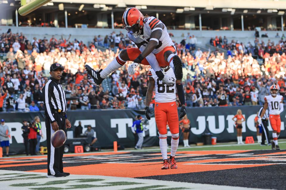 Cleveland Browns' David Njoku (85) celebrates a touchdown reception during the second half of an NFL football game against the Cincinnati Bengals, Sunday, Nov. 7, 2021, in Cincinnati. (AP Photo/Aaron Doster)