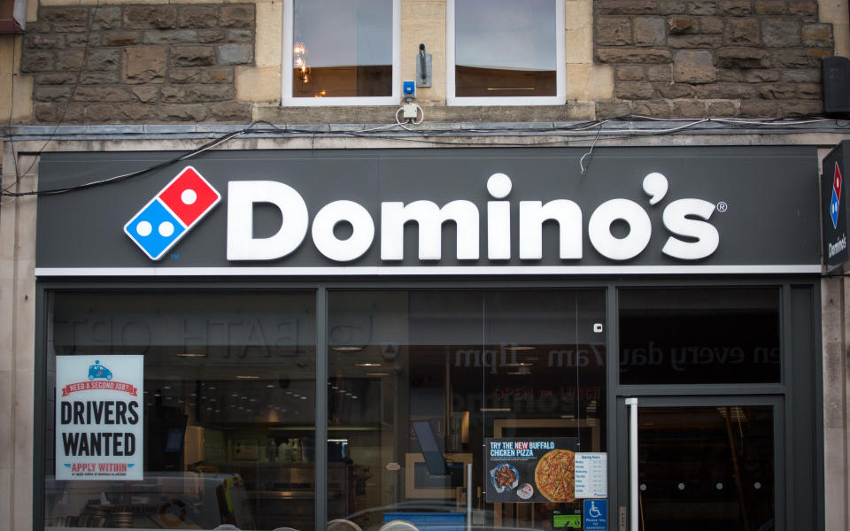 BATH, ENGLAND - FEBRUARY 19:  A branch of Domino's pizza takeaway is pictured on February 19, 2018 in Bath, England. The number of takeaway restaurants has increased significantly in the last few years and this has raised concerns that this can lead to over-consumption in cheap, unhealthy high-fat nutrient-poor food and drink leading to higher body weight and greater risk of obesity.  (Photo by Matt Cardy/Getty Images)