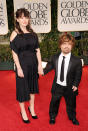 BEVERLY HILLS, CA - JANUARY 15: Actor Peter Dinklage (R) and Erica Schmidt arrive at the 69th Annual Golden Globe Awards held at the Beverly Hilton Hotel on January 15, 2012 in Beverly Hills, California. (Photo by Jason Merritt/Getty Images)