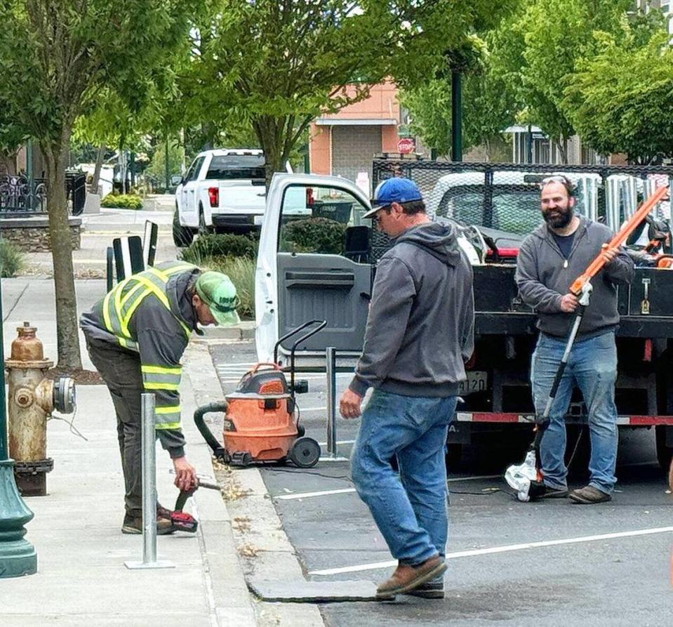 Crews have been working on prepping an area in the Village at Chambers Bay in University Place for parking meter installation.